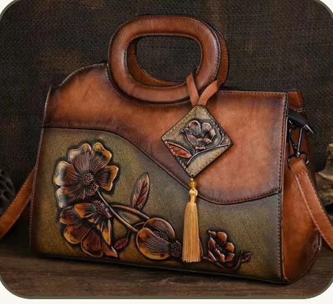 Simone Acc. Collection mood board — tooled leather bag with floral detail